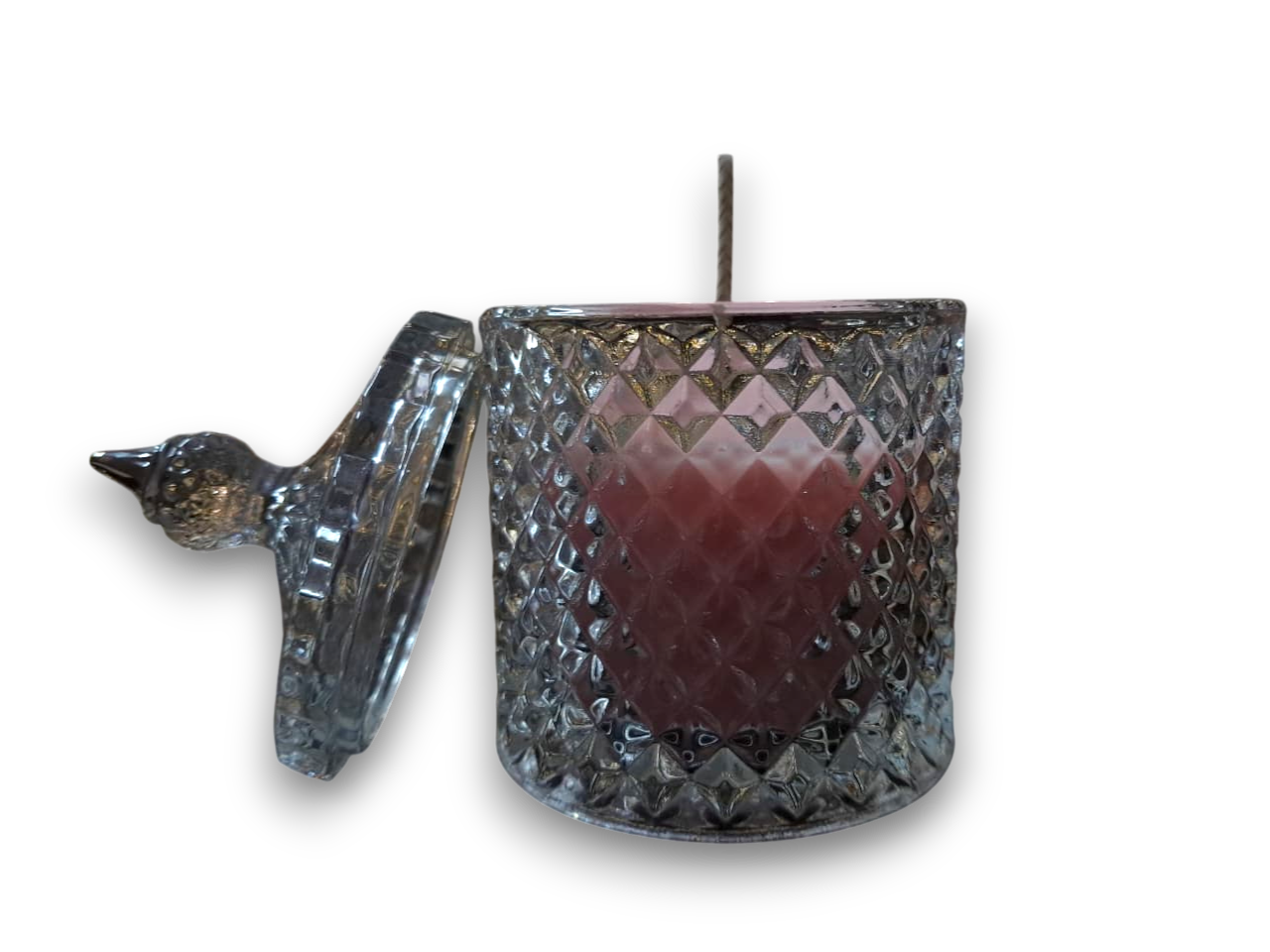 Decorative glass candle holder with a bird design on a white background